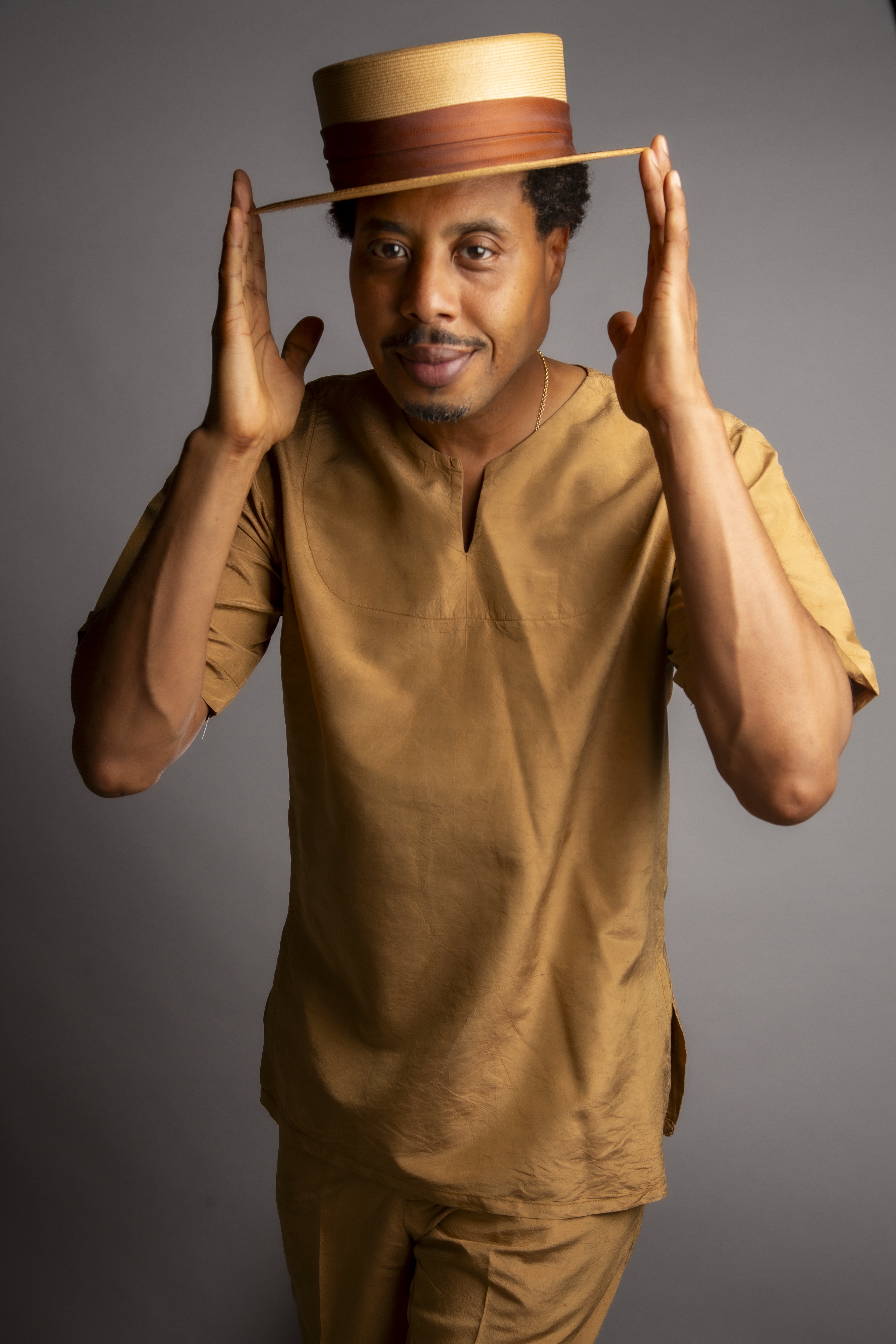 Brother El Portrait with gold silk outfit captured by Cecil Mcdonald Jr.