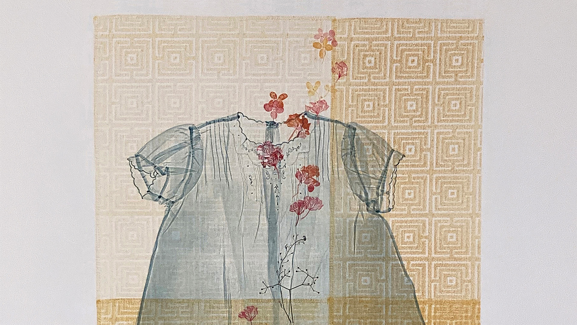 A print of a blue dress with red florals on a yellow patterned background.