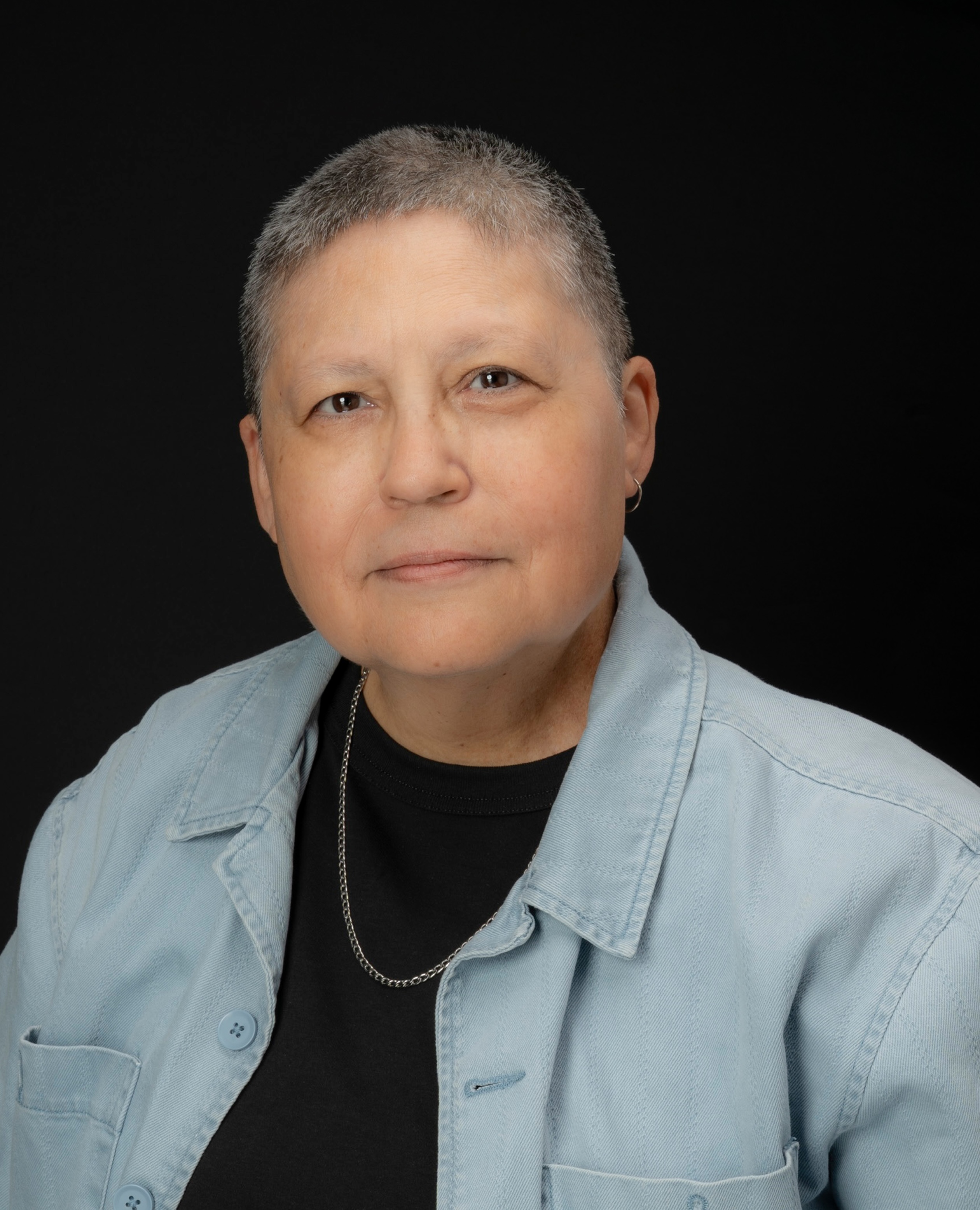 Color Image of woman gently smiling at the camera