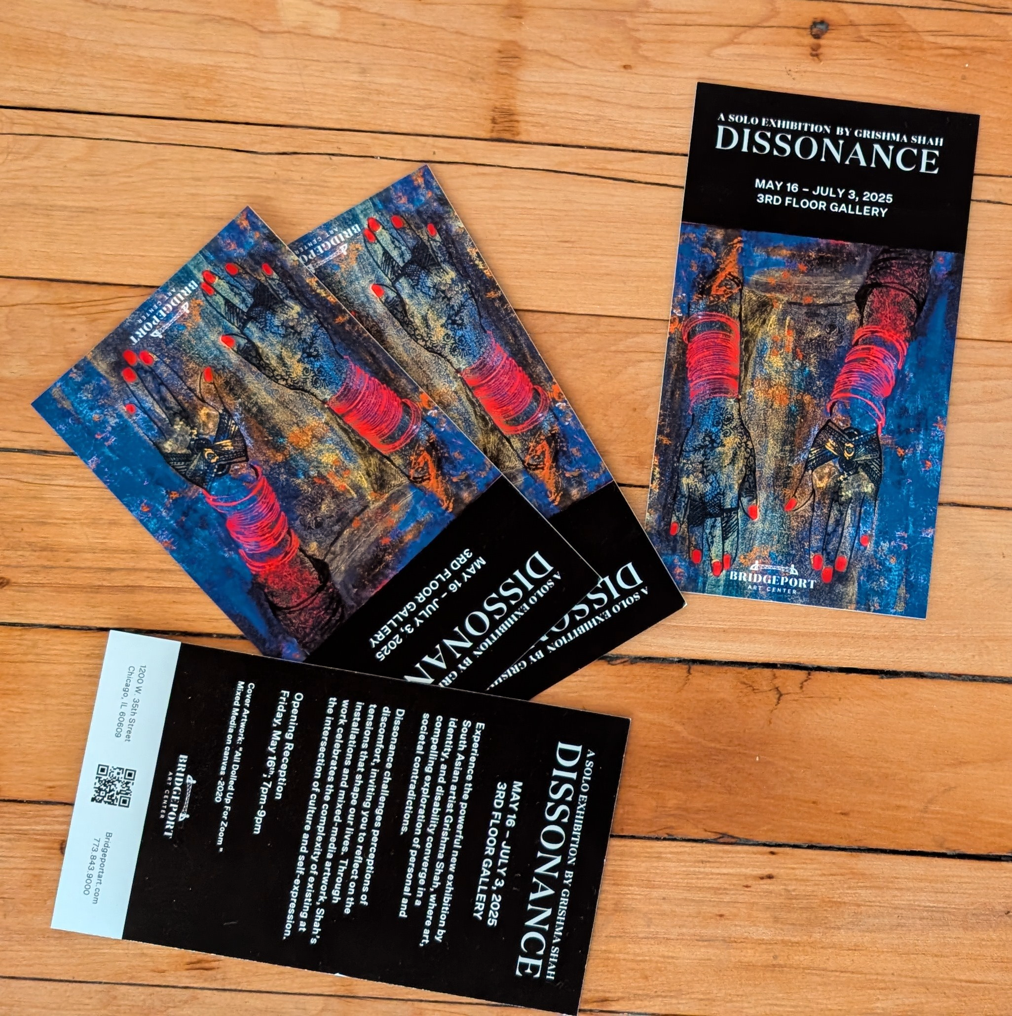 Multiple Brochures saying "Dissonance: A Solo Art Exhibition by Grishma Shah"
