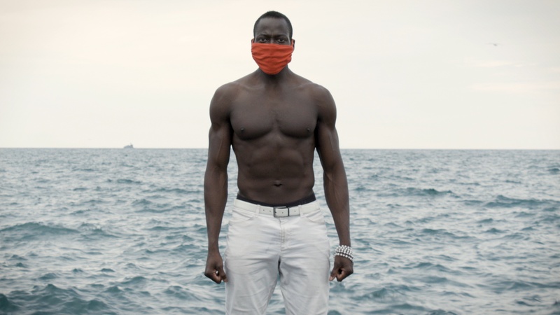  Actor standing against Lake Michigan at 31st street beach. 