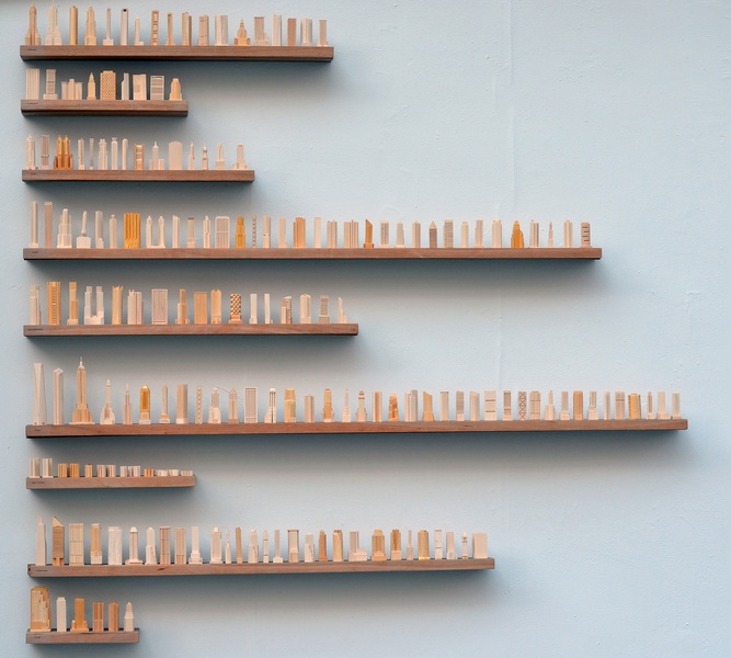  150 wood models of NYC skyscrapers organized by types of building 
