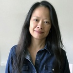 Chinese American woman with long black hair and brown eyes
