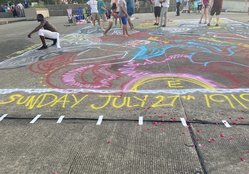  children and adults dancing, chalk painting concrete. 31st Street Beach 