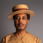 Brother El headshot with vintage boater hat captured by Cecil Mcdonald Jr.
