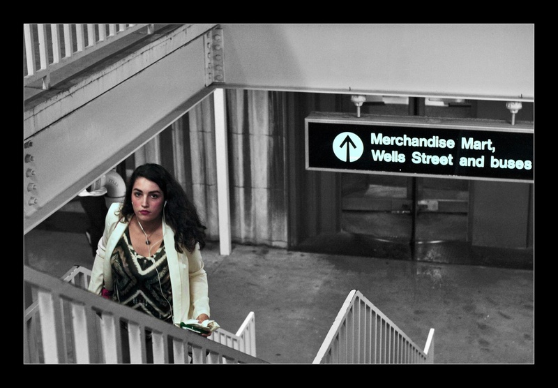  Selective color candid photo of a beautiful woman walking up the stairs at Merchandise Mart 