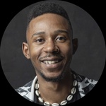 Black, Queer, Short Hair, Dark Brown Eyes. He/They.