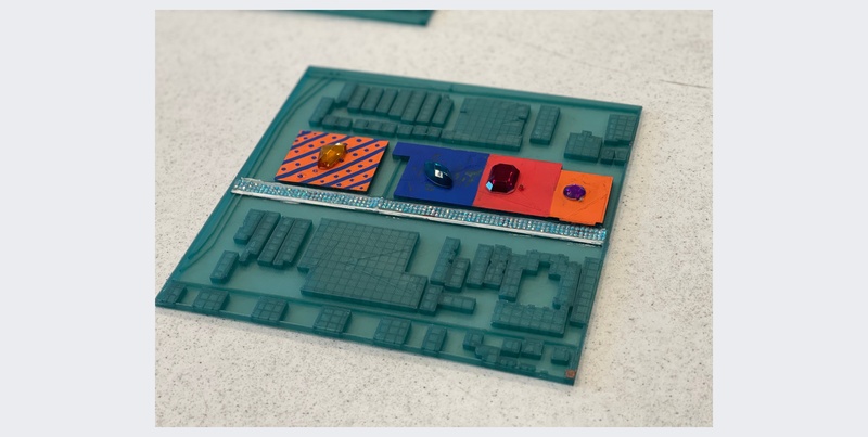  A multi colored three dimensional model of a theater. 