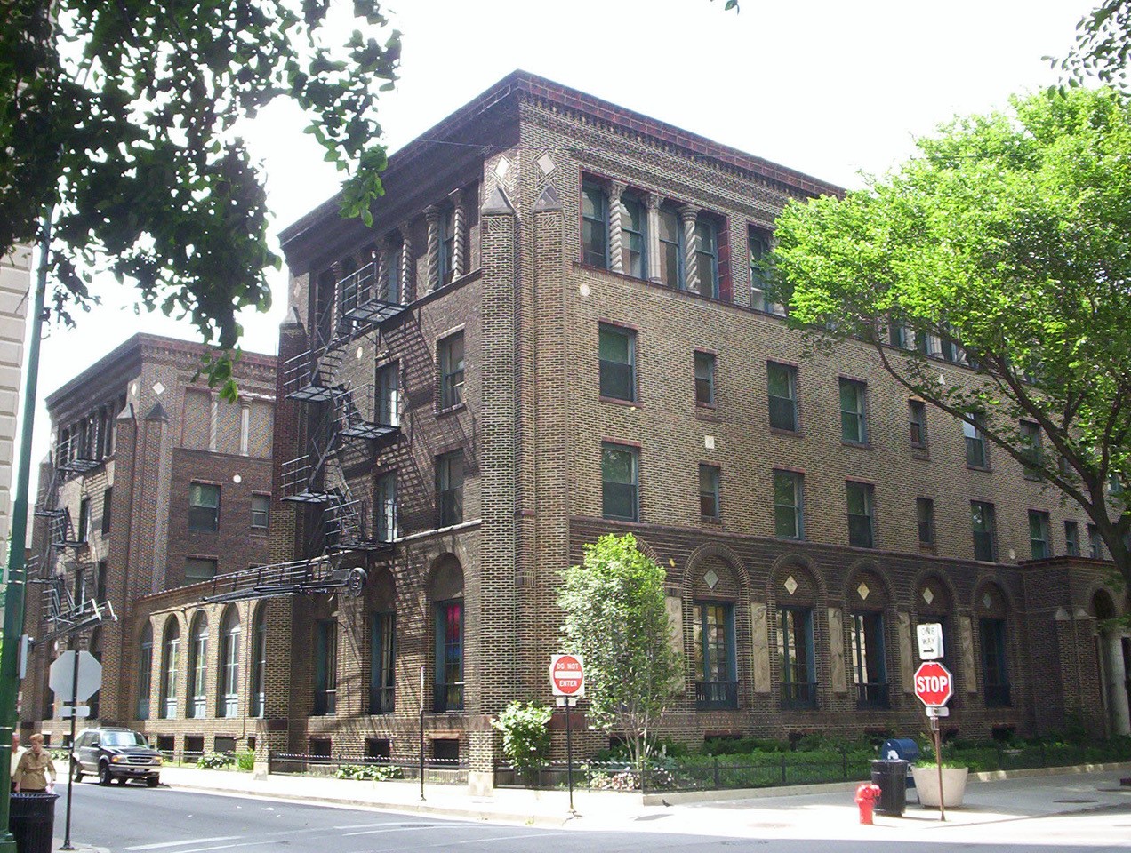 Exterior image of three story brown brick building