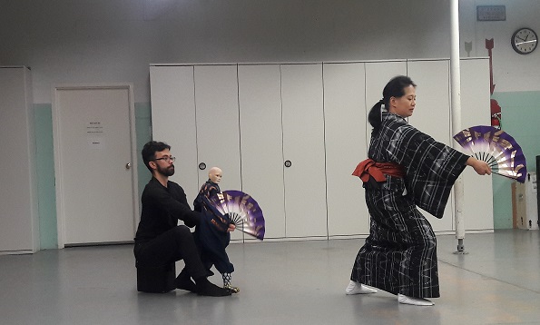 Japanese classical dancer rehearsing with puppet