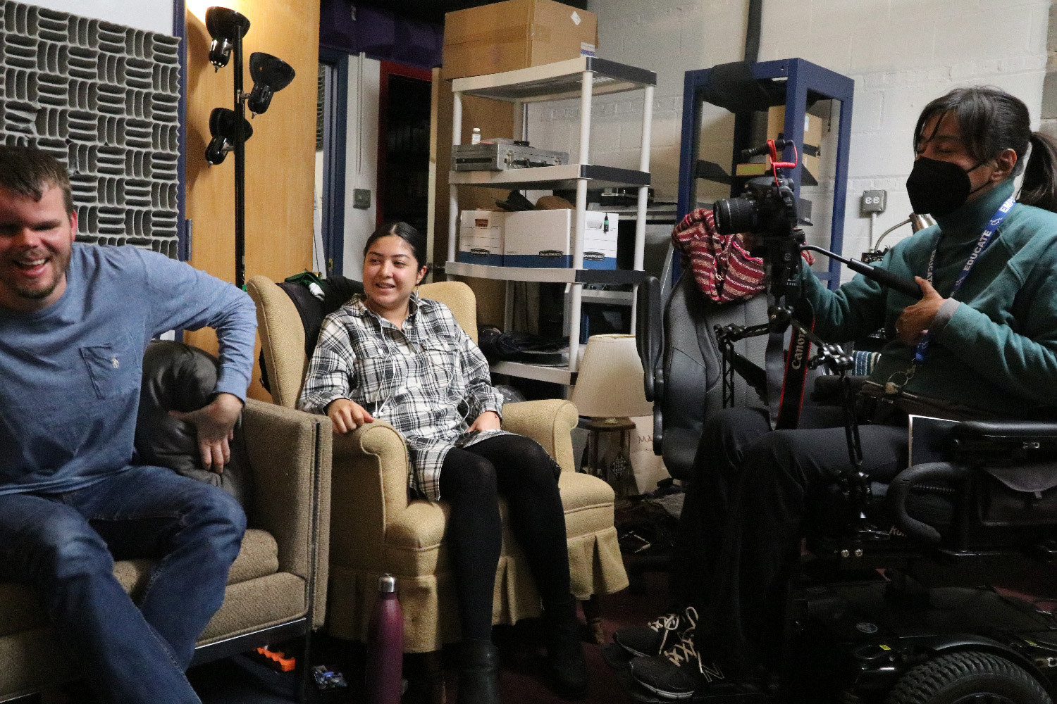 Tommy Carroll, Reveca Torres, and Stephanie Alma laughing at a recording studio